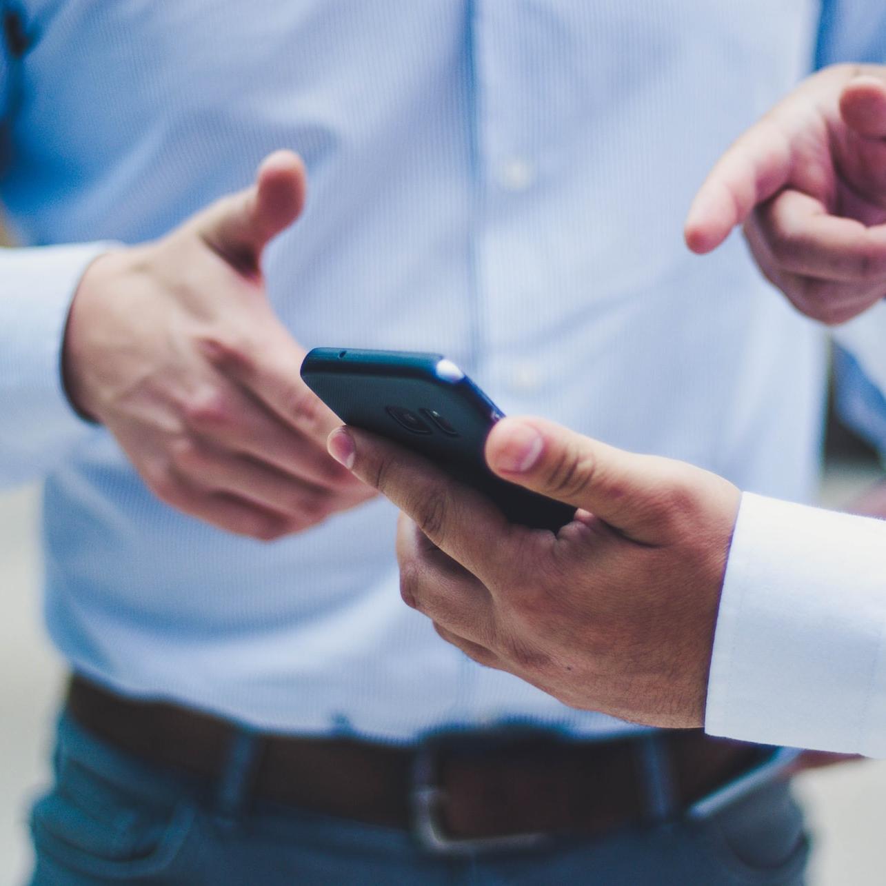 person holding black smartphone